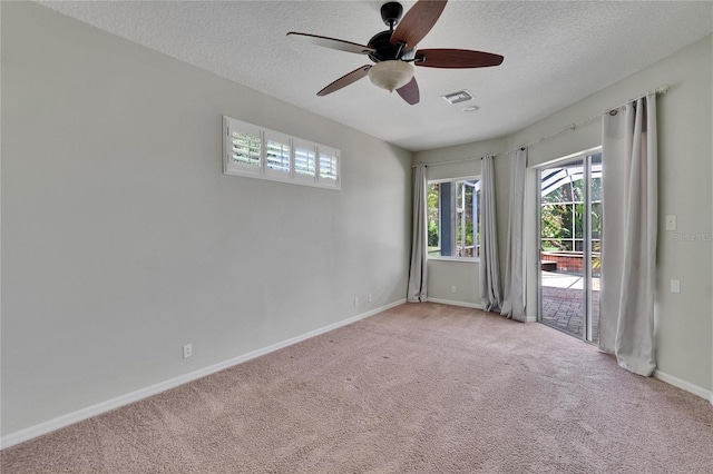 27440 Cedar Park Ct, Wesley Chapel, FL 33544 - unfurnished room featuring a ceiling fan, a textured ceiling, carpet floors, and baseboards