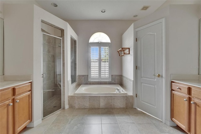 27440 Cedar Park Ct, Wesley Chapel, FL 33544 - bathroom with vanity, a garden tub, and a shower stall