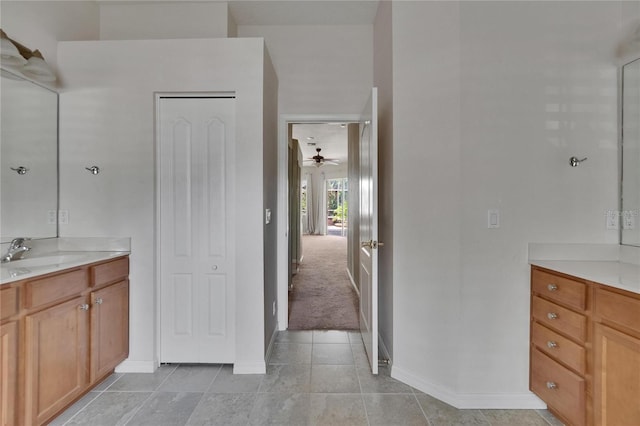 27440 Cedar Park Ct, Wesley Chapel, FL 33544 - bathroom featuring vanity, baseboards, tile patterned floors, and ceiling fan