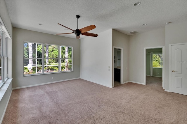 27440 Cedar Park Ct, Wesley Chapel, FL 33544 - carpeted spare room with a ceiling fan, a textured ceiling, and baseboards