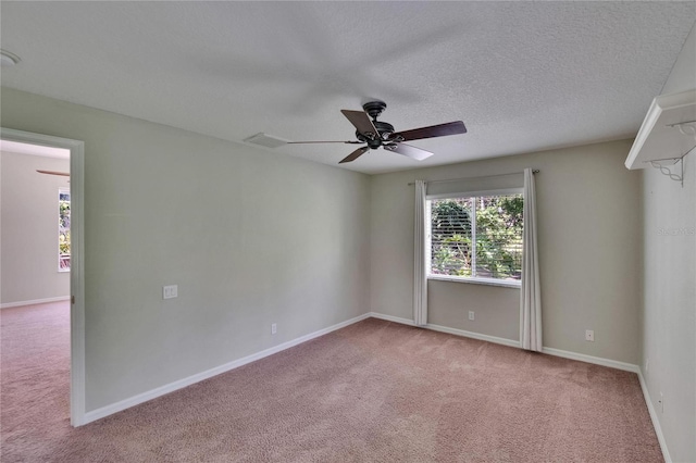 27440 Cedar Park Ct, Wesley Chapel, FL 33544 - carpeted empty room featuring ceiling fan, baseboards, and a textured ceiling
