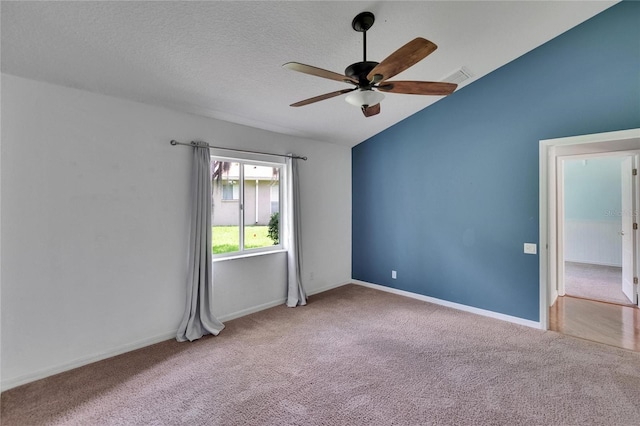 27440 Cedar Park Ct, Wesley Chapel, FL 33544 - carpeted empty room featuring a ceiling fan, vaulted ceiling, and baseboards