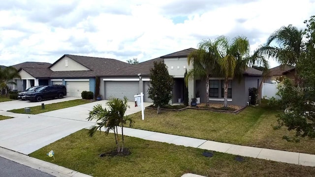 14015 Arbor Pines Dr, Riverview, FL 33579 - ranch-style home featuring concrete driveway, a garage, a front yard, and stucco siding