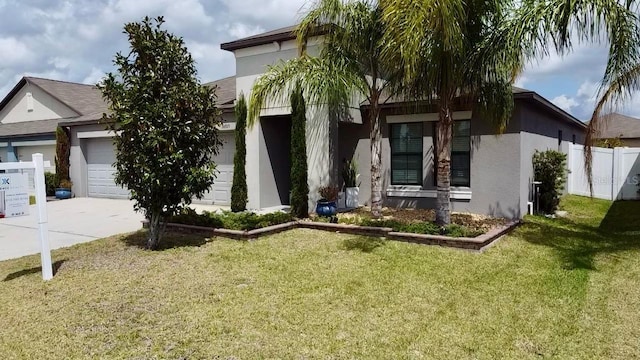 14015 Arbor Pines Dr, Riverview, FL 33579 - view of front of property with stucco siding, an attached garage, and driveway