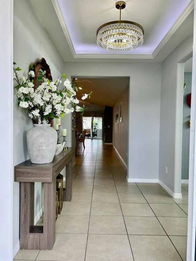 14015 Arbor Pines Dr, Riverview, FL 33579 - corridor with a raised ceiling, light tile patterned floors, and crown molding