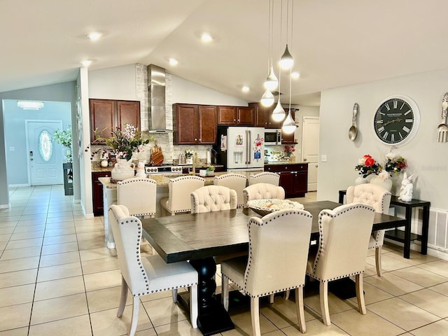 14015 Arbor Pines Dr, Riverview, FL 33579 - dining room with vaulted ceiling, light tile patterned floors, and baseboards