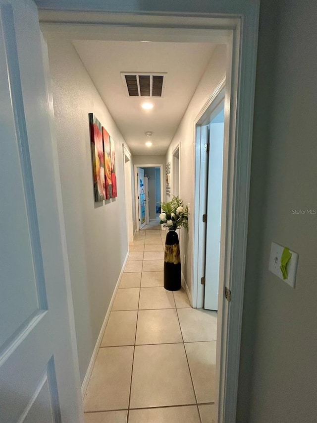 14015 Arbor Pines Dr, Riverview, FL 33579 - hallway featuring light tile patterned floors and baseboards