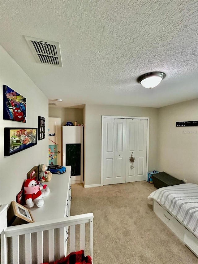14015 Arbor Pines Dr, Riverview, FL 33579 - bedroom with light colored carpet, a textured ceiling, and a closet