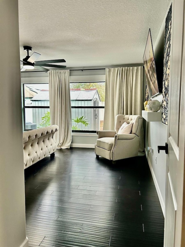 14015 Arbor Pines Dr, Riverview, FL 33579 - living area with a textured ceiling, ceiling fan, baseboards, and dark wood finished floors