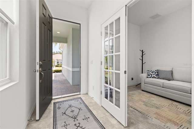 1890 Flora Pass Pl, Kissimmee, FL 34747 - doorway featuring light tile patterned floors and baseboards