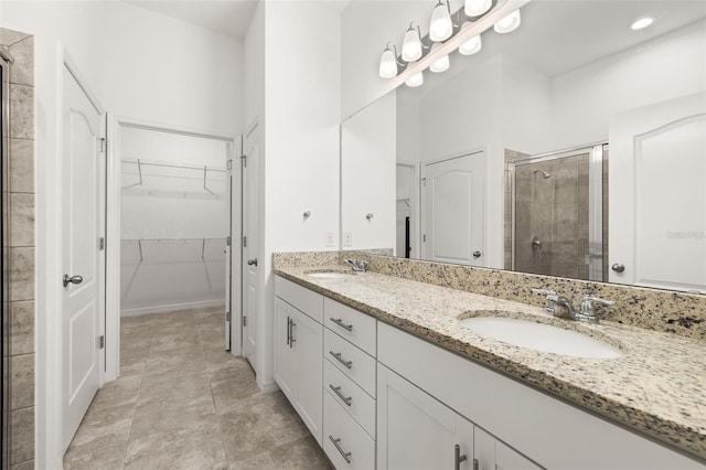 1890 Flora Pass Pl, Kissimmee, FL 34747 - full bath with a shower stall, double vanity, and a walk in closet