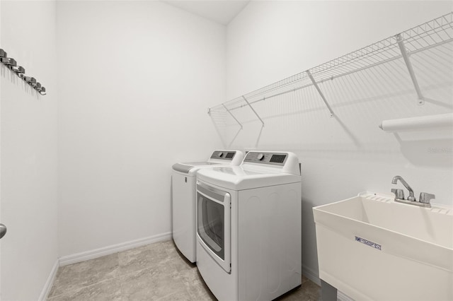 1890 Flora Pass Pl, Kissimmee, FL 34747 - laundry area featuring washing machine and dryer and baseboards