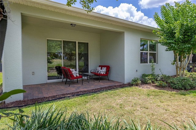 1890 Flora Pass Pl, Kissimmee, FL 34747 - back of property featuring stucco siding, a yard, and a patio