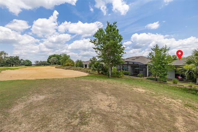 1890 Flora Pass Pl, Kissimmee, FL 34747 - view of grassy yard with glass enclosure