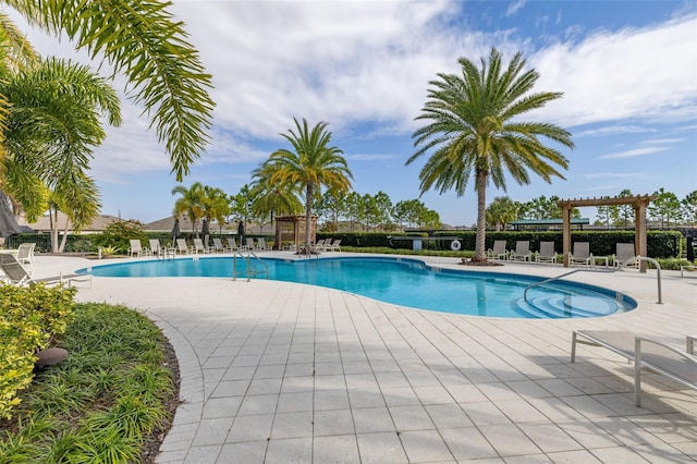 1890 Flora Pass Pl, Kissimmee, FL 34747 - community pool with a patio area