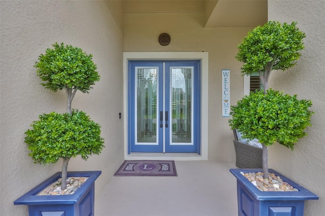 6016 Shadowlake Dr, Apollo Beach, FL 33572 - property entrance featuring french doors and stucco siding