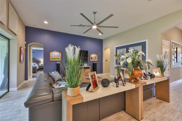 6016 Shadowlake Dr, Apollo Beach, FL 33572 - office area featuring arched walkways, ceiling fan, recessed lighting, light wood-style floors, and baseboards