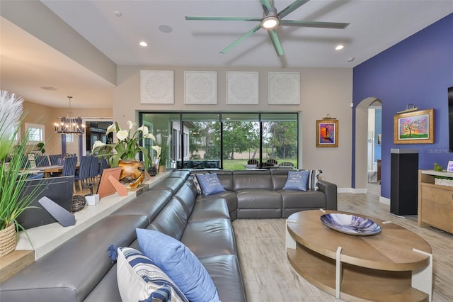 6016 Shadowlake Dr, Apollo Beach, FL 33572 - living room featuring a ceiling fan, light wood-type flooring, arched walkways, a chandelier, and recessed lighting
