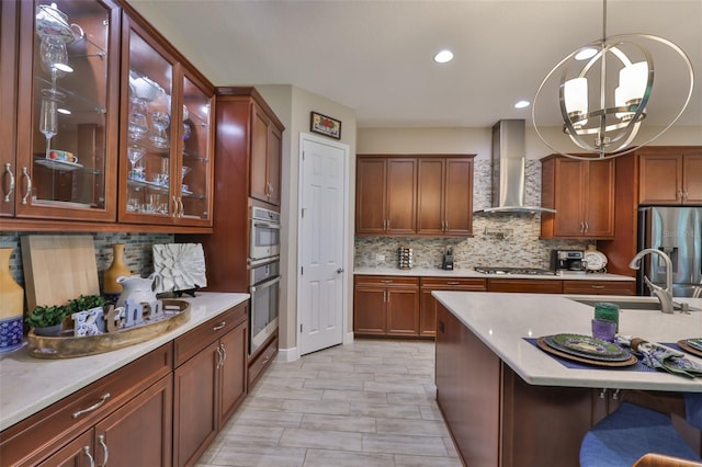 6016 Shadowlake Dr, Apollo Beach, FL 33572 - kitchen featuring wall chimney range hood, stainless steel appliances, a sink, backsplash, and recessed lighting