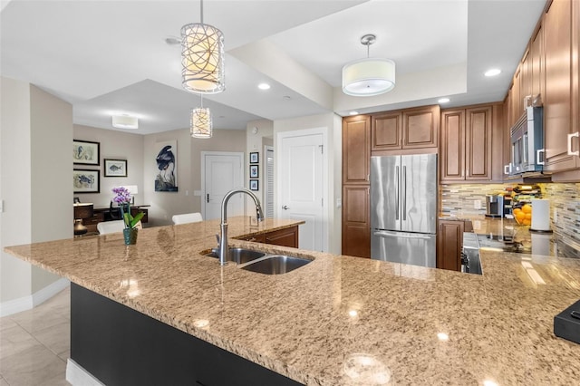 1325 Snell Isle Blvd NE Unit 708, Saint Petersburg, FL 33704 - kitchen with appliances with stainless steel finishes, a sink, light stone countertops, brown cabinets, and recessed lighting