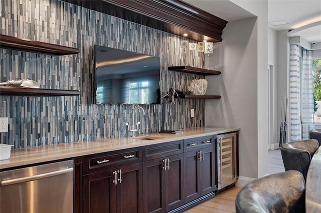 1325 Snell Isle Blvd NE Unit 708, Saint Petersburg, FL 33704 - indoor wet bar with beverage cooler, dishwasher, tasteful backsplash, light wood-type flooring, and baseboards