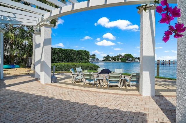 1325 Snell Isle Blvd NE Unit 708, Saint Petersburg, FL 33704 - view of patio with a pergola, a water view, and outdoor dining space