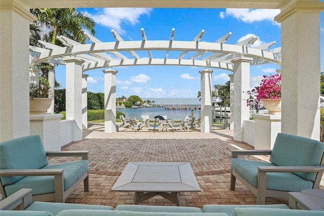 1325 Snell Isle Blvd NE Unit 708, Saint Petersburg, FL 33704 - view of patio featuring a water view, a pergola, and an outdoor hangout area