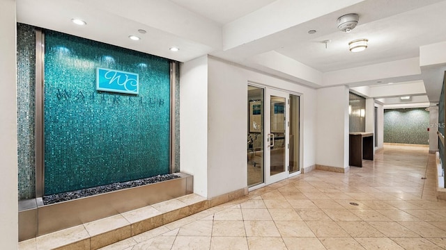 1325 Snell Isle Blvd NE Unit 708, Saint Petersburg, FL 33704 - corridor featuring recessed lighting, baseboards, an accent wall, and tile patterned flooring
