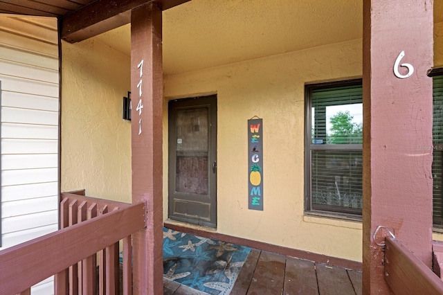 7741 Forest Trl Unit 6, Port Richey, FL 34668 - view of exterior entry featuring stucco siding