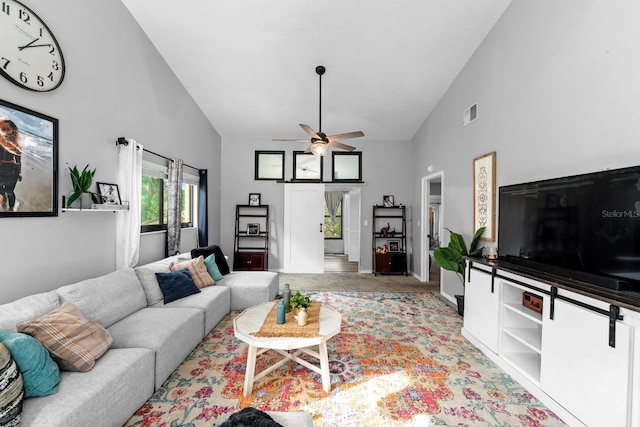7741 Forest Trl Unit 6, Port Richey, FL 34668 - living room featuring high vaulted ceiling, ceiling fan, light colored carpet, and baseboards