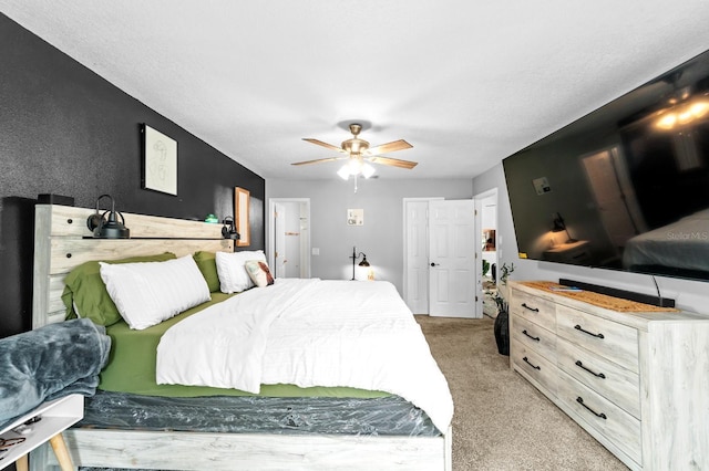 7741 Forest Trl Unit 6, Port Richey, FL 34668 - bedroom with light colored carpet and a ceiling fan
