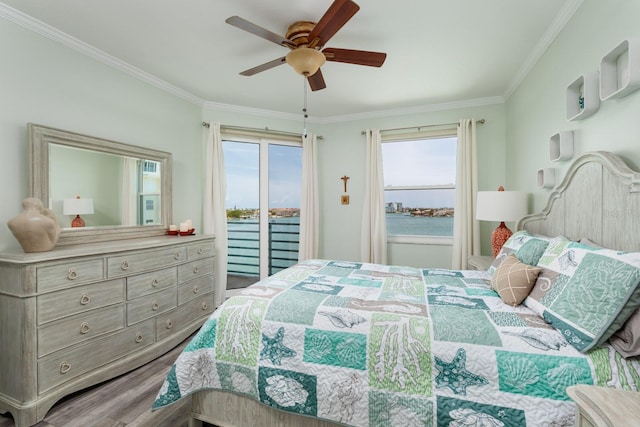 7932 Sailboat Key Blvd S Unit 506, South Pasadena, FL 33707 - bedroom with access to outside, ornamental molding, wood finished floors, multiple windows, and a ceiling fan