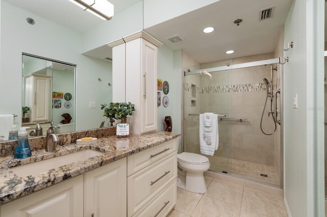 7932 Sailboat Key Blvd S Unit 506, South Pasadena, FL 33707 - full bathroom featuring vanity, a stall shower, toilet, tile patterned flooring, and recessed lighting