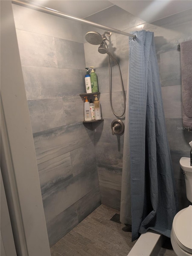4705 NE 1st St NE Unit 327, Saint Petersburg, FL 33703 - full bathroom featuring toilet and a stall shower
