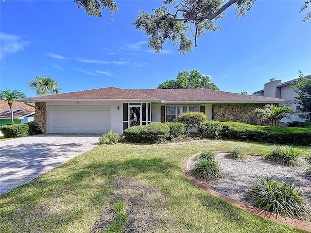 13725 Oak Forest Blvd N, Seminole, FL 33776 - ranch-style house with a garage, driveway, stucco siding, a front yard, and stone siding