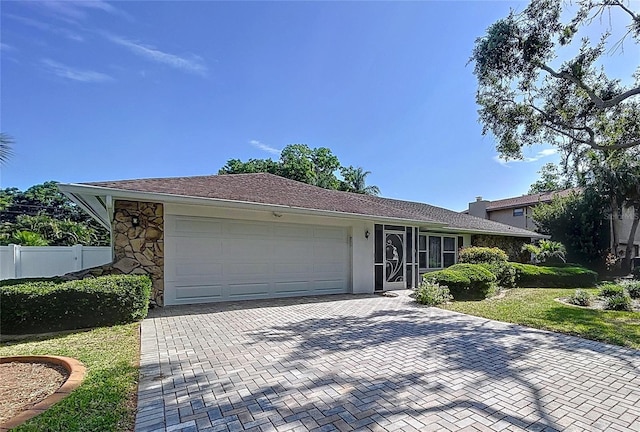 13725 Oak Forest Blvd N, Seminole, FL 33776 - view of front of home featuring an attached garage and decorative driveway