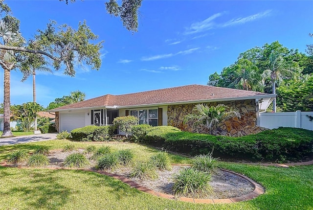 13725 Oak Forest Blvd N, Seminole, FL 33776 - ranch-style home with an attached garage and concrete driveway