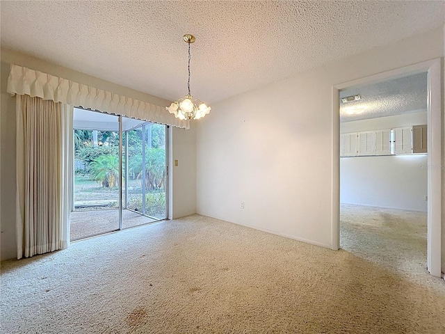 13725 Oak Forest Blvd N, Seminole, FL 33776 - unfurnished room featuring carpet flooring, a chandelier, and a textured ceiling