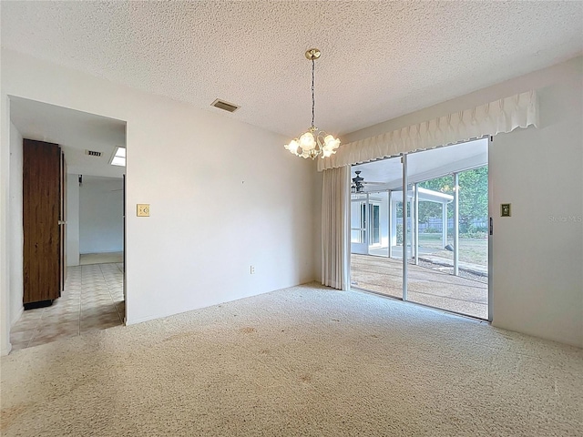 13725 Oak Forest Blvd N, Seminole, FL 33776 - carpeted spare room with a chandelier and a textured ceiling