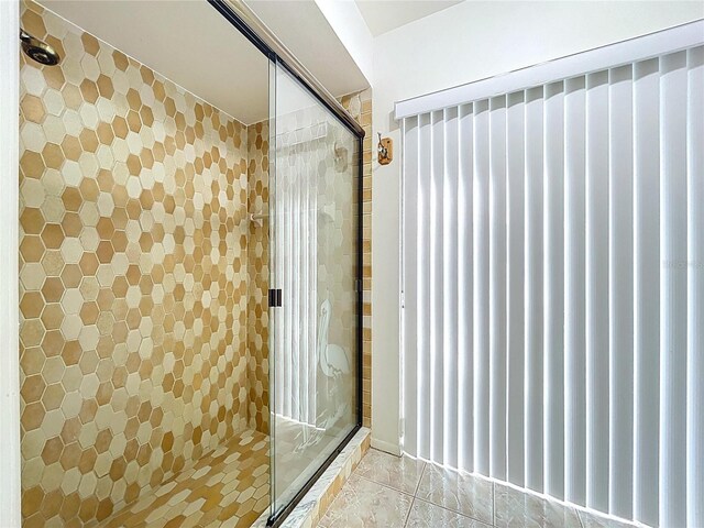 13725 Oak Forest Blvd N, Seminole, FL 33776 - full bathroom with a stall shower and tile patterned floors