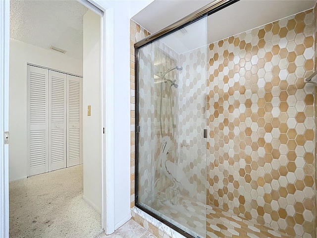 13725 Oak Forest Blvd N, Seminole, FL 33776 - full bathroom featuring a shower stall and a closet