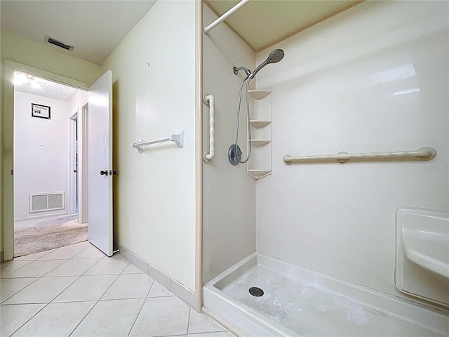 13725 Oak Forest Blvd N, Seminole, FL 33776 - full bathroom featuring a shower and tile patterned flooring