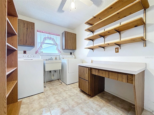 13725 Oak Forest Blvd N, Seminole, FL 33776 - laundry room featuring washing machine and dryer, cabinet space, a textured ceiling, ceiling fan, and a desk
