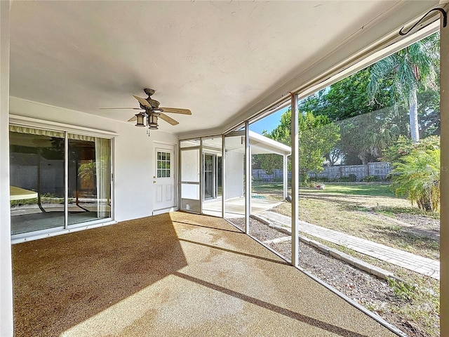 13725 Oak Forest Blvd N, Seminole, FL 33776 - unfurnished sunroom with a ceiling fan