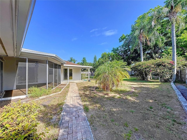 13725 Oak Forest Blvd N, Seminole, FL 33776 - view of yard with a sunroom