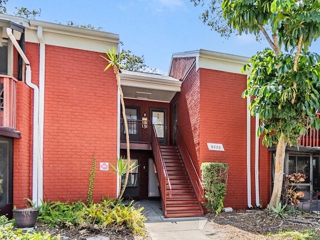 8220 12th Way N Unit G, Saint Petersburg, FL 33702 - view of building exterior featuring stairs