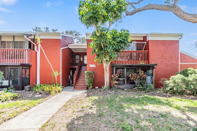 8220 12th Way N Unit G, Saint Petersburg, FL 33702 - view of front of property with brick siding and stairway