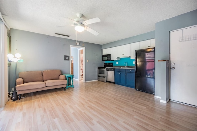 8220 12th Way N Unit G, Saint Petersburg, FL 33702 - living room with light wood-type flooring, a ceiling fan, a textured ceiling, and baseboards