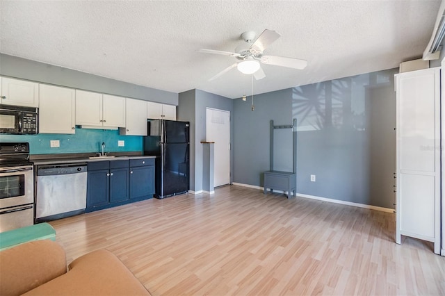 8220 12th Way N Unit G, Saint Petersburg, FL 33702 - kitchen with black appliances, ceiling fan, light wood-style floors, white cabinetry, and a textured ceiling