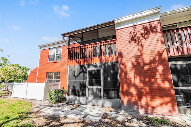 8220 12th Way N Unit G, Saint Petersburg, FL 33702 - back of property featuring a balcony and brick siding